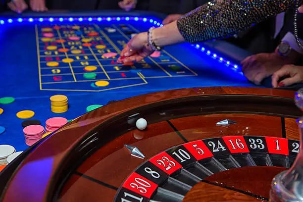 Mobile phone screen showing baccarat table interface Mobile phone screen showing baccarat table interface